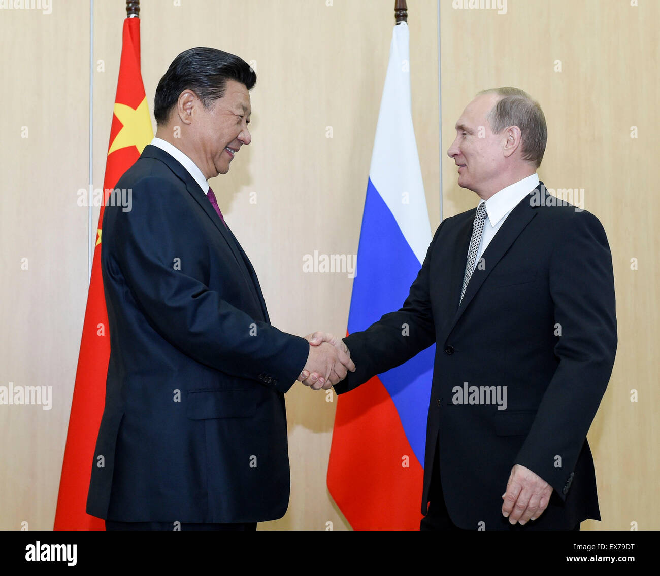 Ufa, Russia. 8th July, 2015. Chinese President Xi Jinping (L) shakes hands with his Russian counterpart Vladimir Putin in Ufa, Russia, July 8, 2015. © Li Xueren/Xinhua/Alamy Live News Stock Photo
