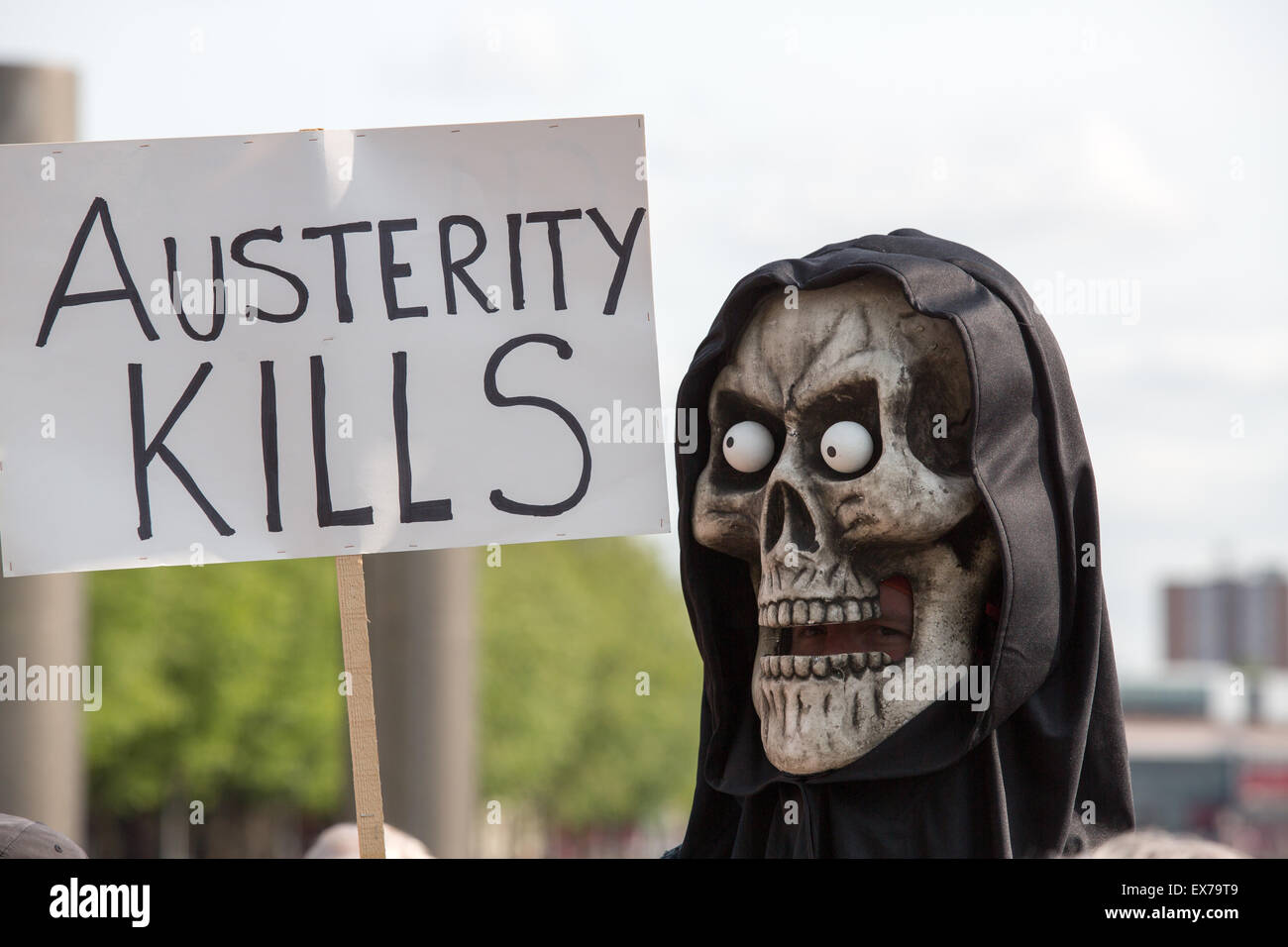 Bristol, UK. 8th July 2015. Hundreds of people gather in Bristol for a 'mass die-in' to protest the Conservative government austerity measures Credit:  Paul Smith/Alamy Live News Stock Photo