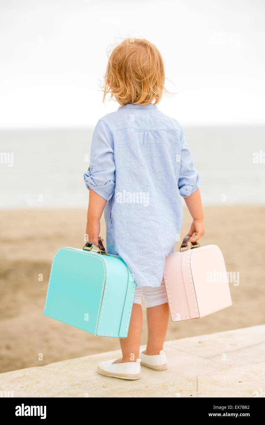 little girl with suitcase