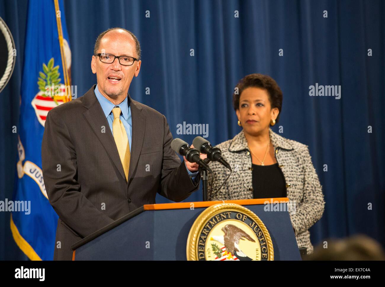 US Secretary of Labor Thomas Perez joins Attorney General Loretta Lynch to discuss ACTeam Phase II implementation in combating human trafficking during a press conference June 25, 2015 in Washington, DC. Stock Photo