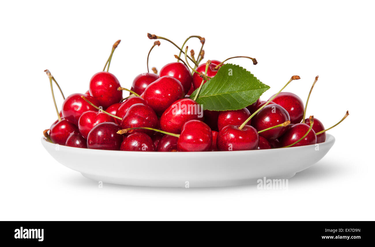 Pile of sweet cherries with leaf on white plate isolated on white background Stock Photo