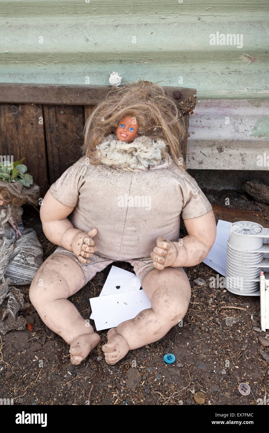 Creepy filthy trash doll Stock Photo
