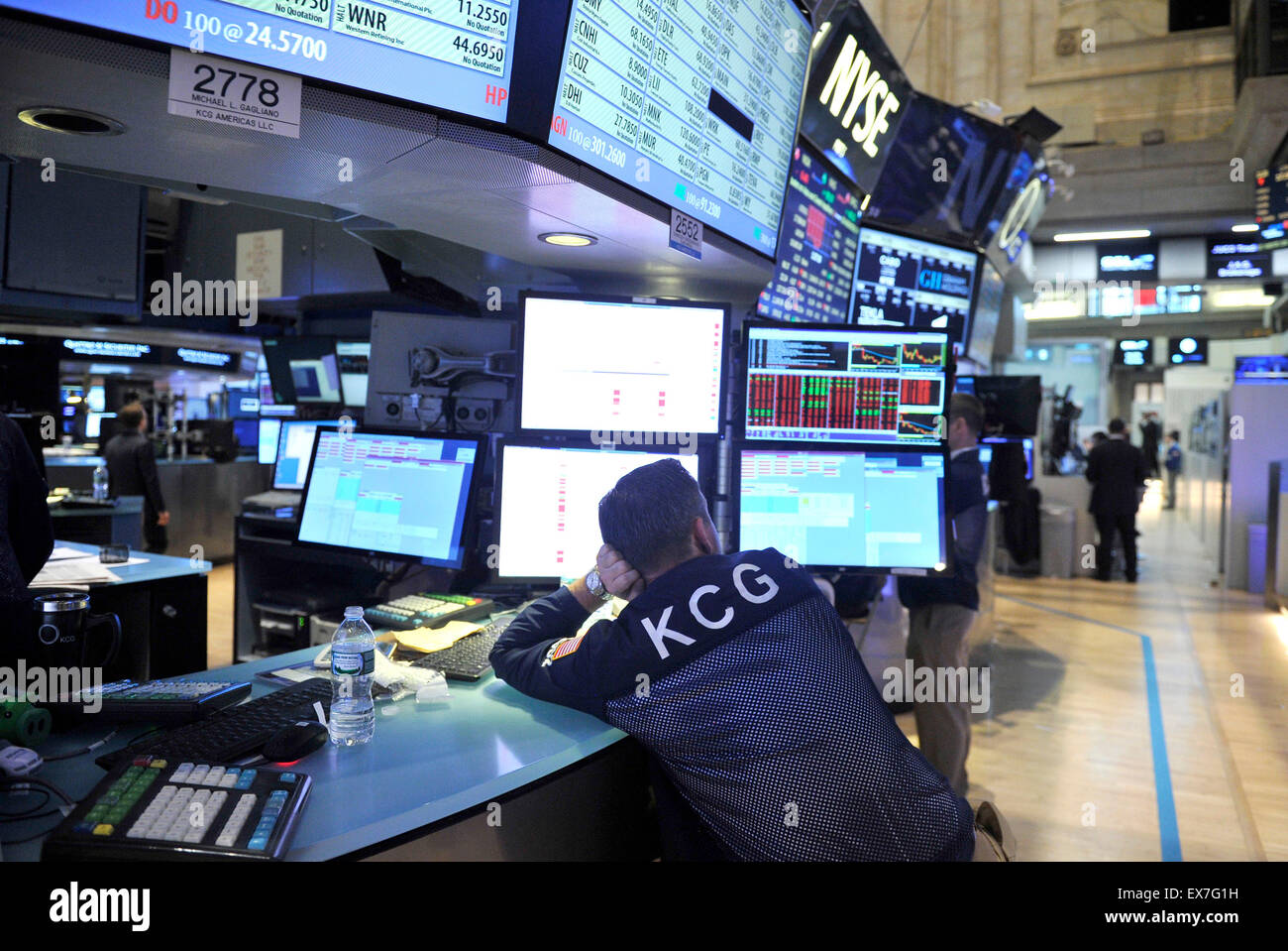 New York, USA. 8th July, 2015. A trader waits at the New York Stock