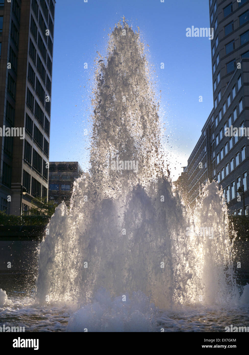 Fountains in Cabot Square said to represent money flowing like water.... Canary Wharf London financial district Stock Photo