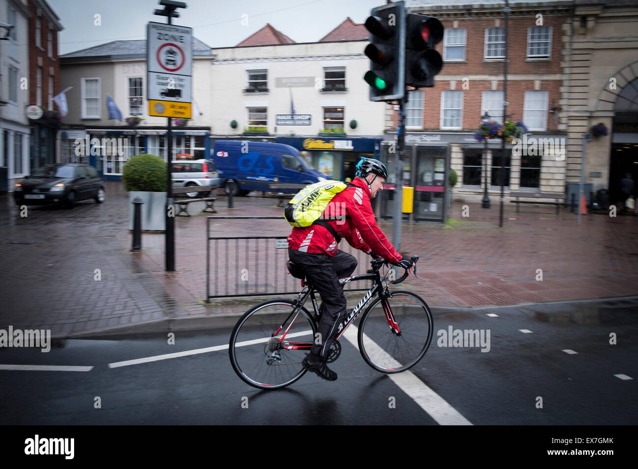 Cycling in city of Salisbury on a wet day Stock Photo