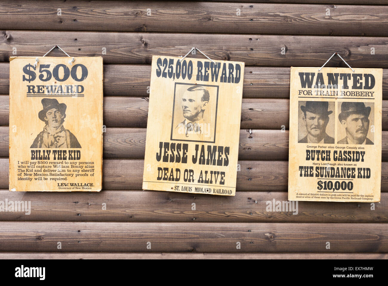 Reproduction posters pinned to a wall of a western-style log cabin - Butch Cassidy, The Sundance Kid, Jesses James and Billy Ki Stock Photo