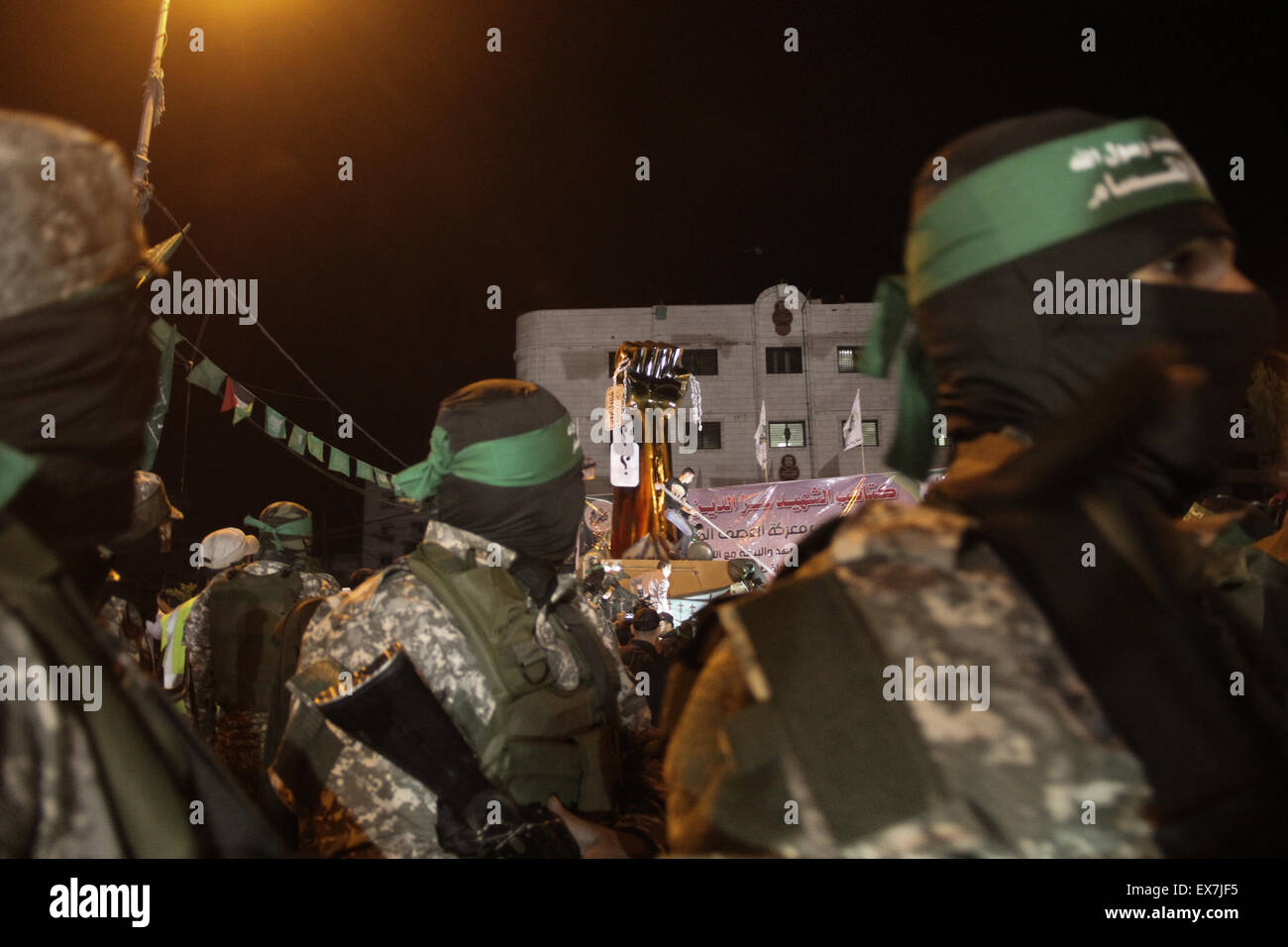 Gaza, Palestine. 08th July, 2015. Palestinian Hamas supporters during a rally held by the Izzedine al-Qassam Brigades, a military wing of Hamas, marking the first anniversary of the Israeli war on Gaza, in central Gaza City. Credit:  Ahmed Hjazy/Pacific Press/Alamy Live News Stock Photo