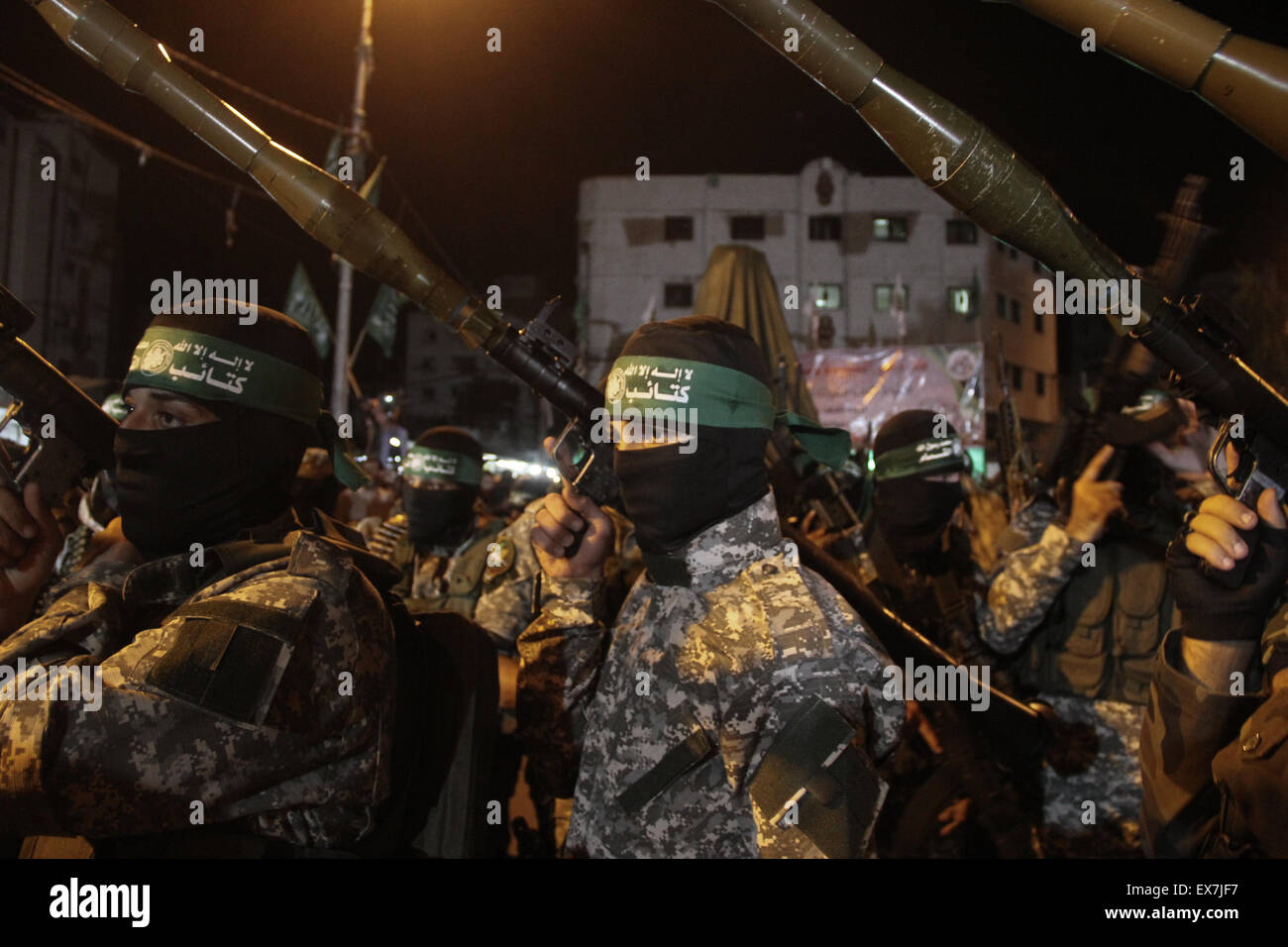 Gaza, Palestine. 08th July, 2015. Palestinian Hamas supporters during a rally held by the Izzedine al-Qassam Brigades, a military wing of Hamas, marking the first anniversary of the Israeli war on Gaza, in central Gaza City. Credit:  Ahmed Hjazy/Pacific Press/Alamy Live News Stock Photo