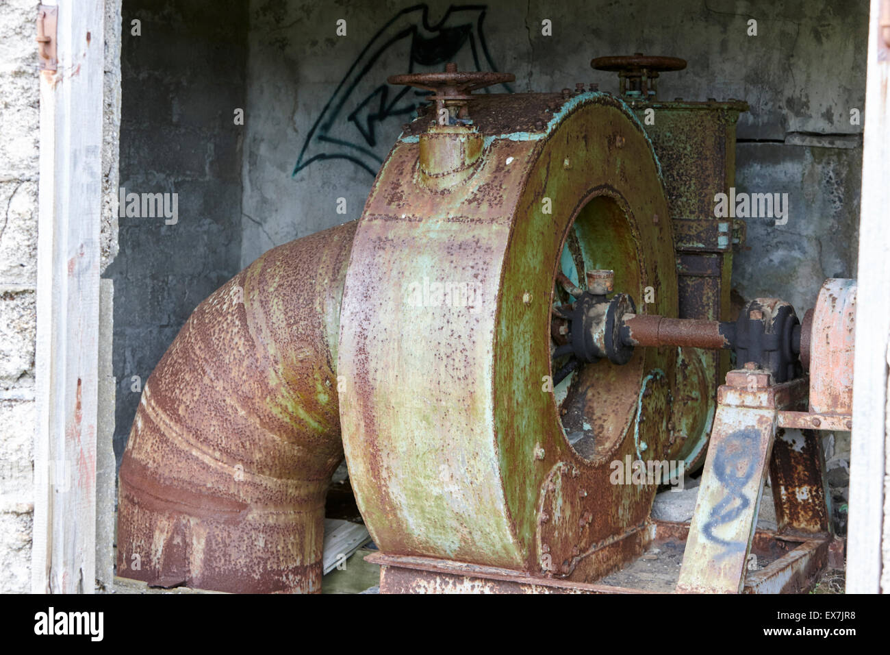 water wheel electricity generation equipment in former small hydro electric station in Hlidarendi Hvolsvollur Iceland Stock Photo