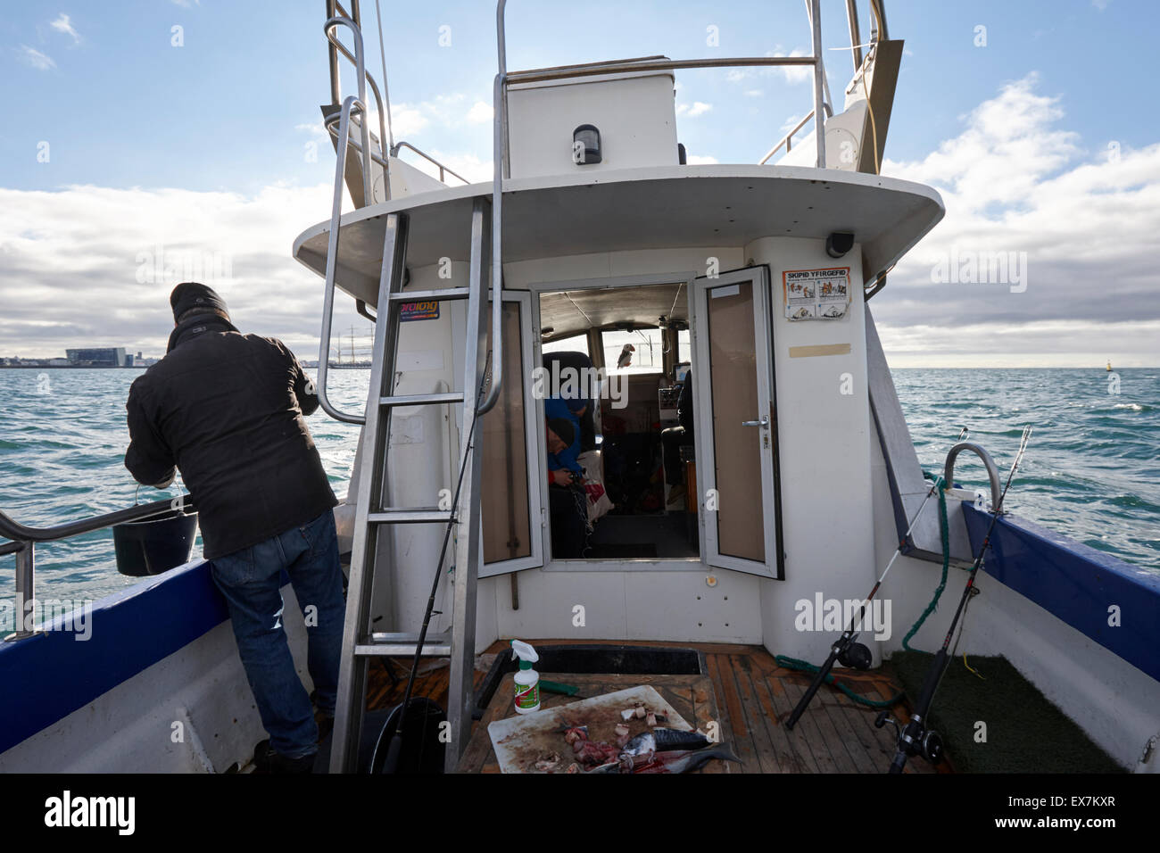 men seafishing on a charter boat Reykjavik iceland Stock Photo