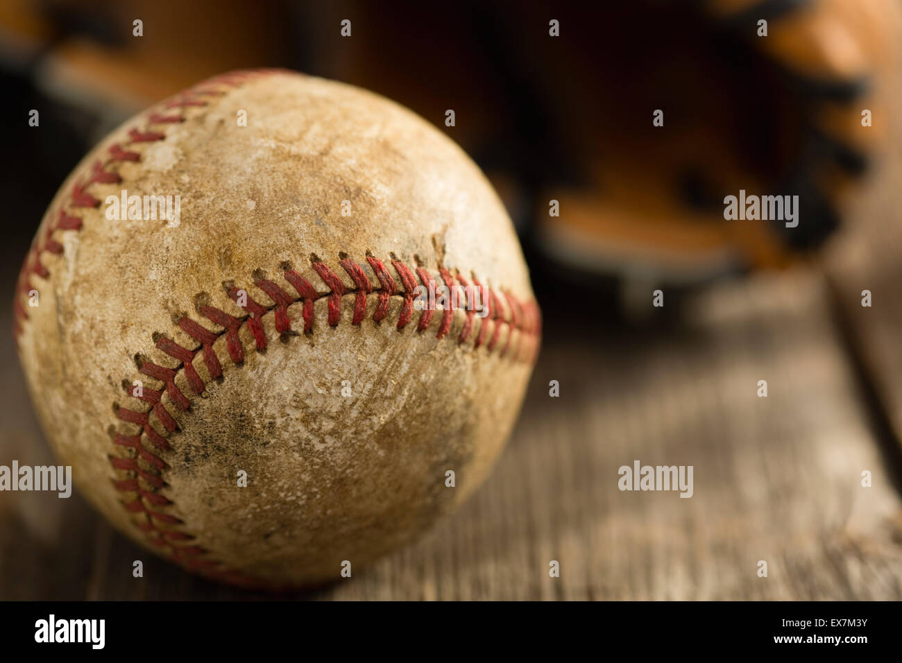 Dirty baseball on wood Stock Photo Alamy