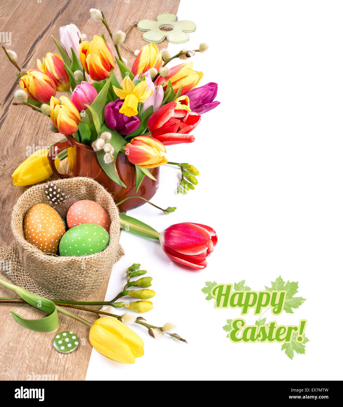Colorful Easter border with bunch of tulips and Easter eggs on wood ...