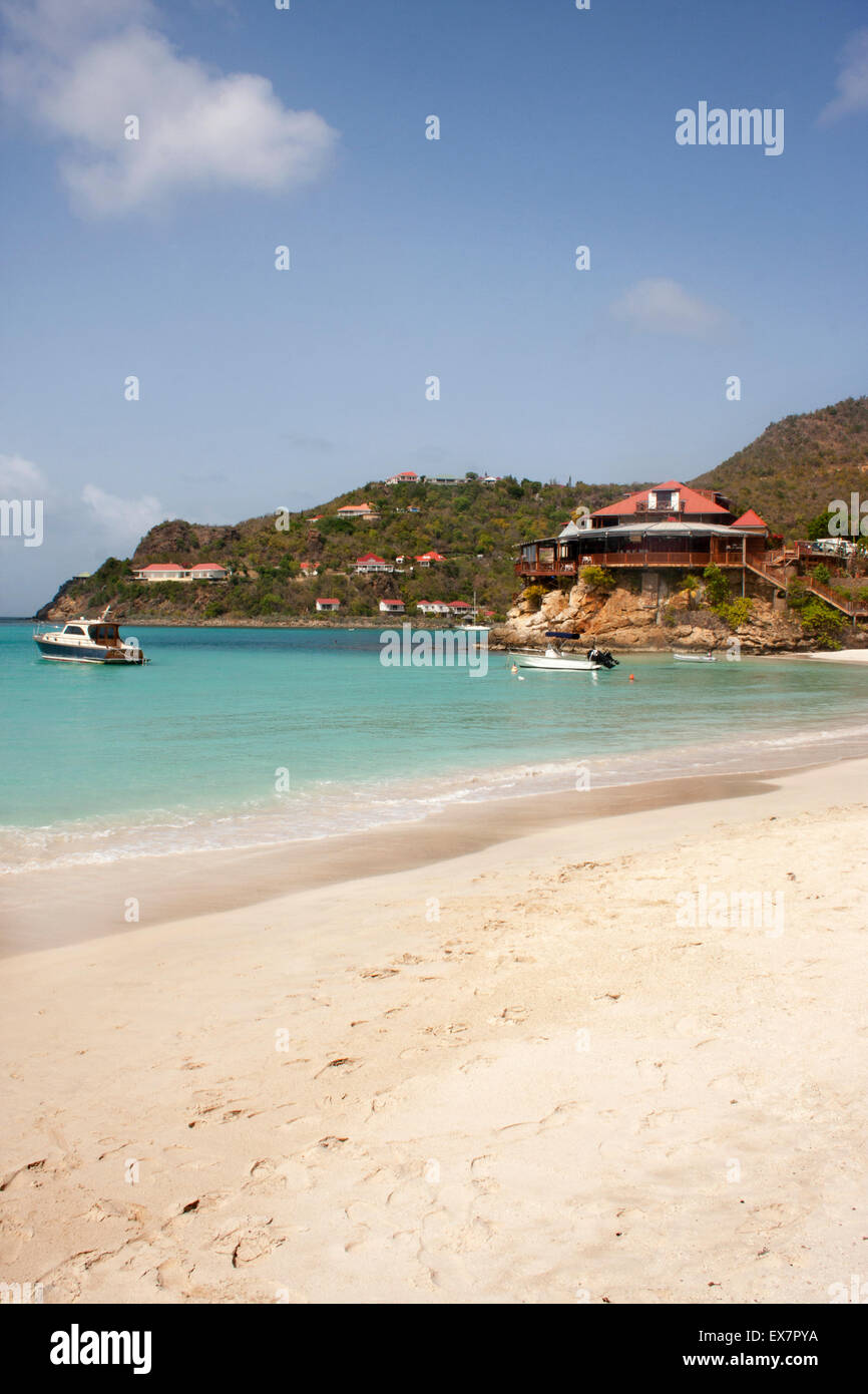 The white sand of St. Jean Beach, in St. Barts, with the Eden Rock in the background Stock Photo