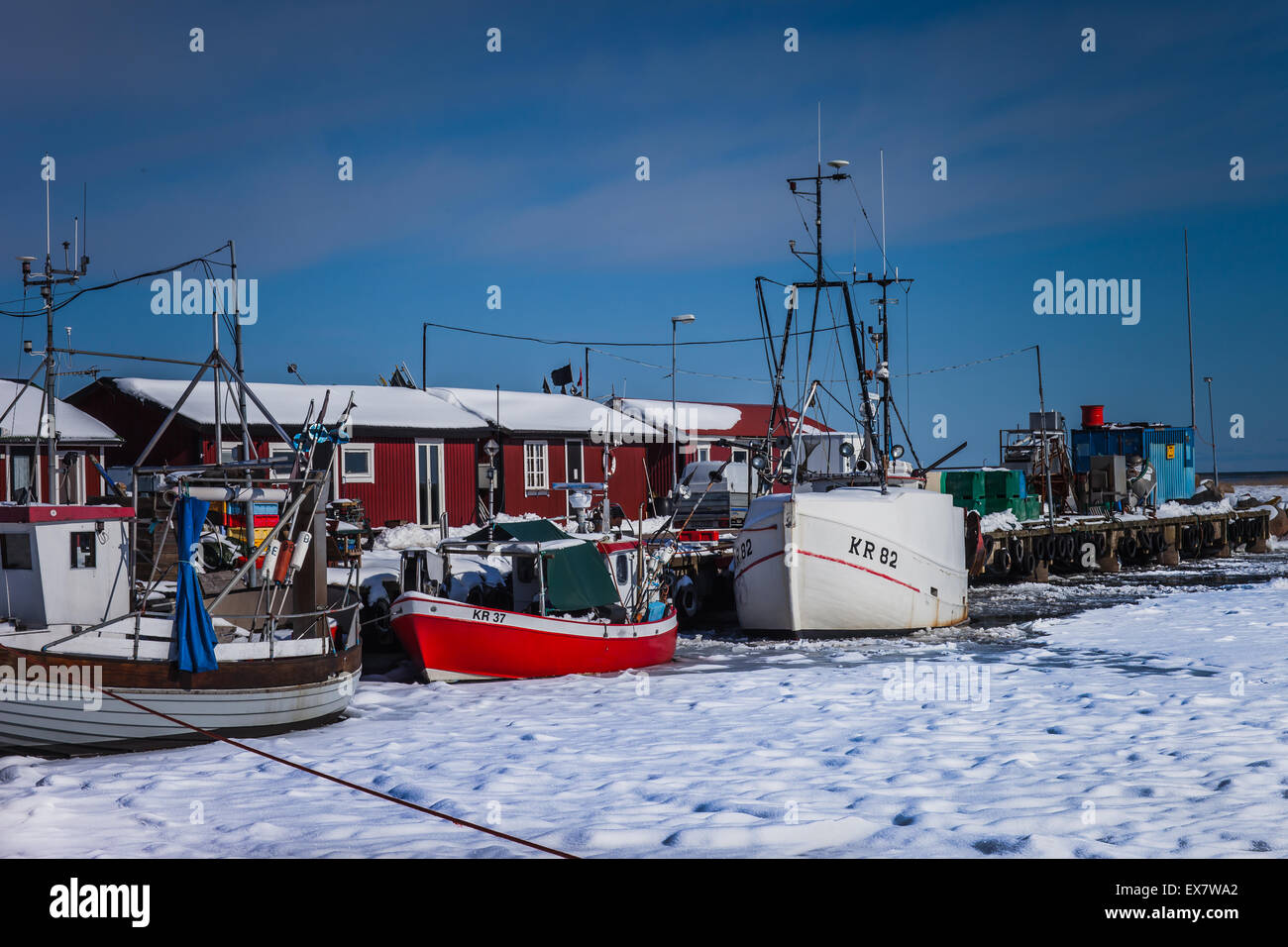 Fishing vessels in port at wintertime Stock Photo