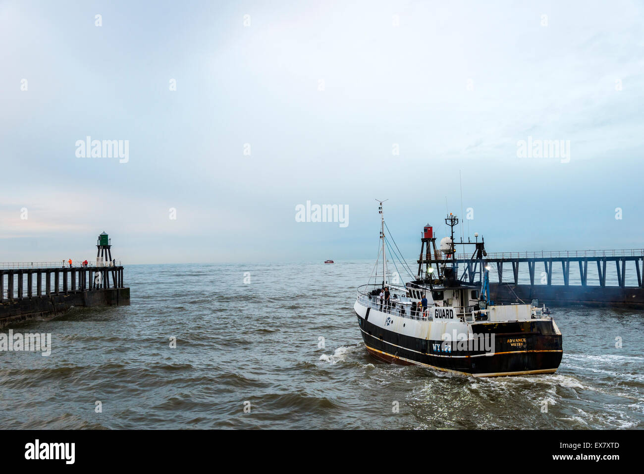 Whitby Harbour and fishing boat in North Yorkshire England Stock Photo ...