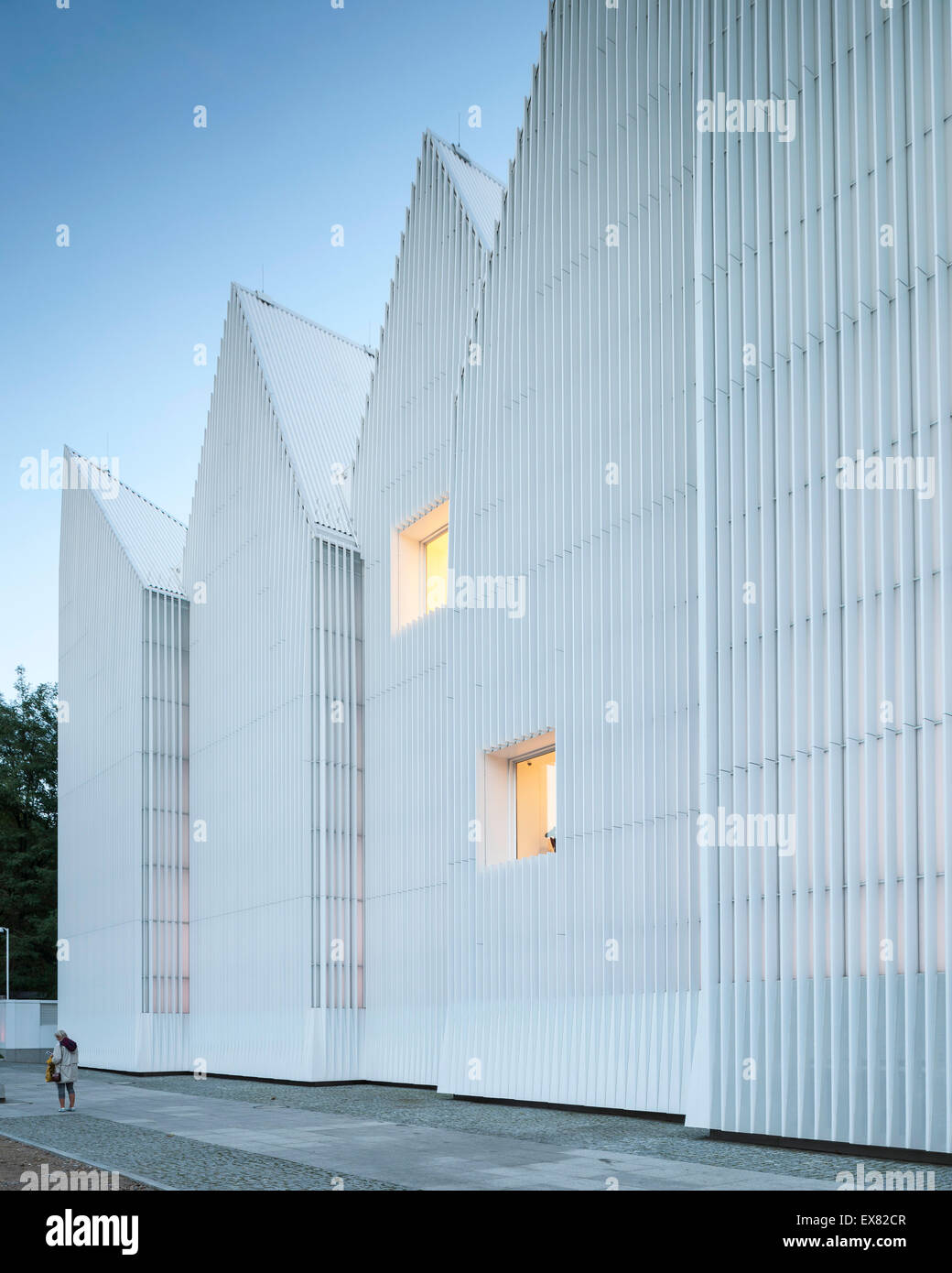 Dusk perspective of luminous exterior facade. Szczecin Philharmonic Hall, Szczecin, Poland. Architect: Estudio Barozzi Veiga, 20 Stock Photo