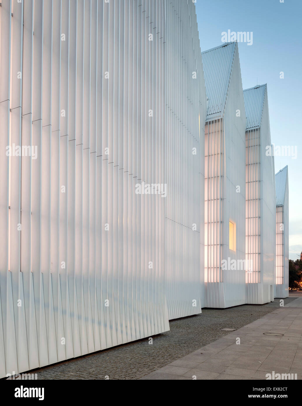 Dusk perspective of luminous exterior facade. Szczecin Philharmonic Hall, Szczecin, Poland. Architect: Estudio Barozzi Veiga, 20 Stock Photo