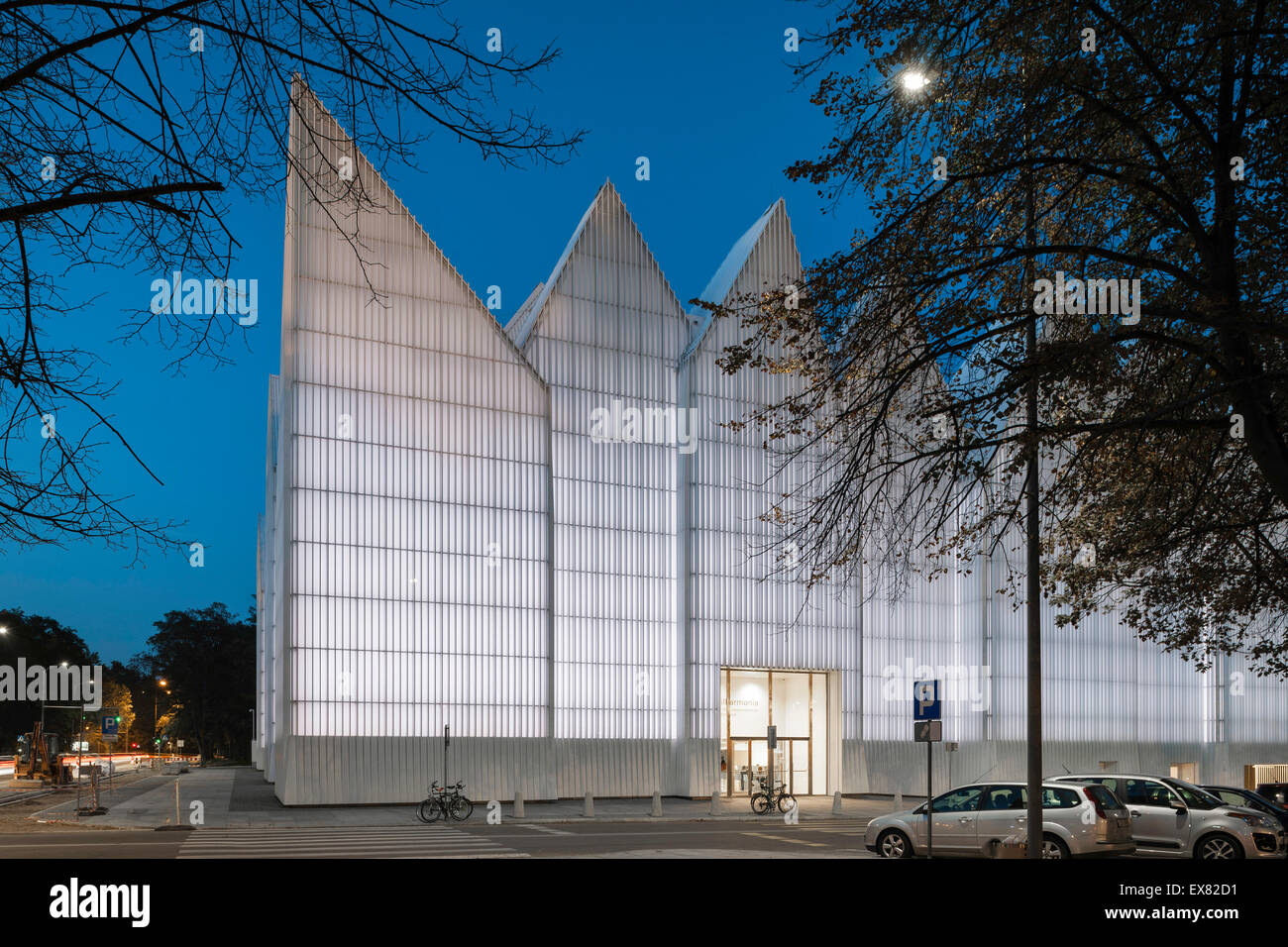 Corner elevation at night. Szczecin Philharmonic Hall, Szczecin, Poland. Architect: Estudio Barozzi Veiga, 2014. Stock Photo