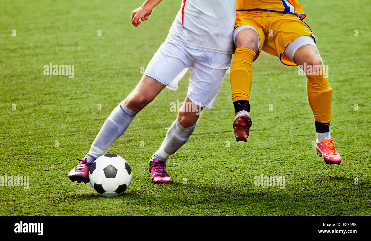 Soccer player legs in action Stock Photo