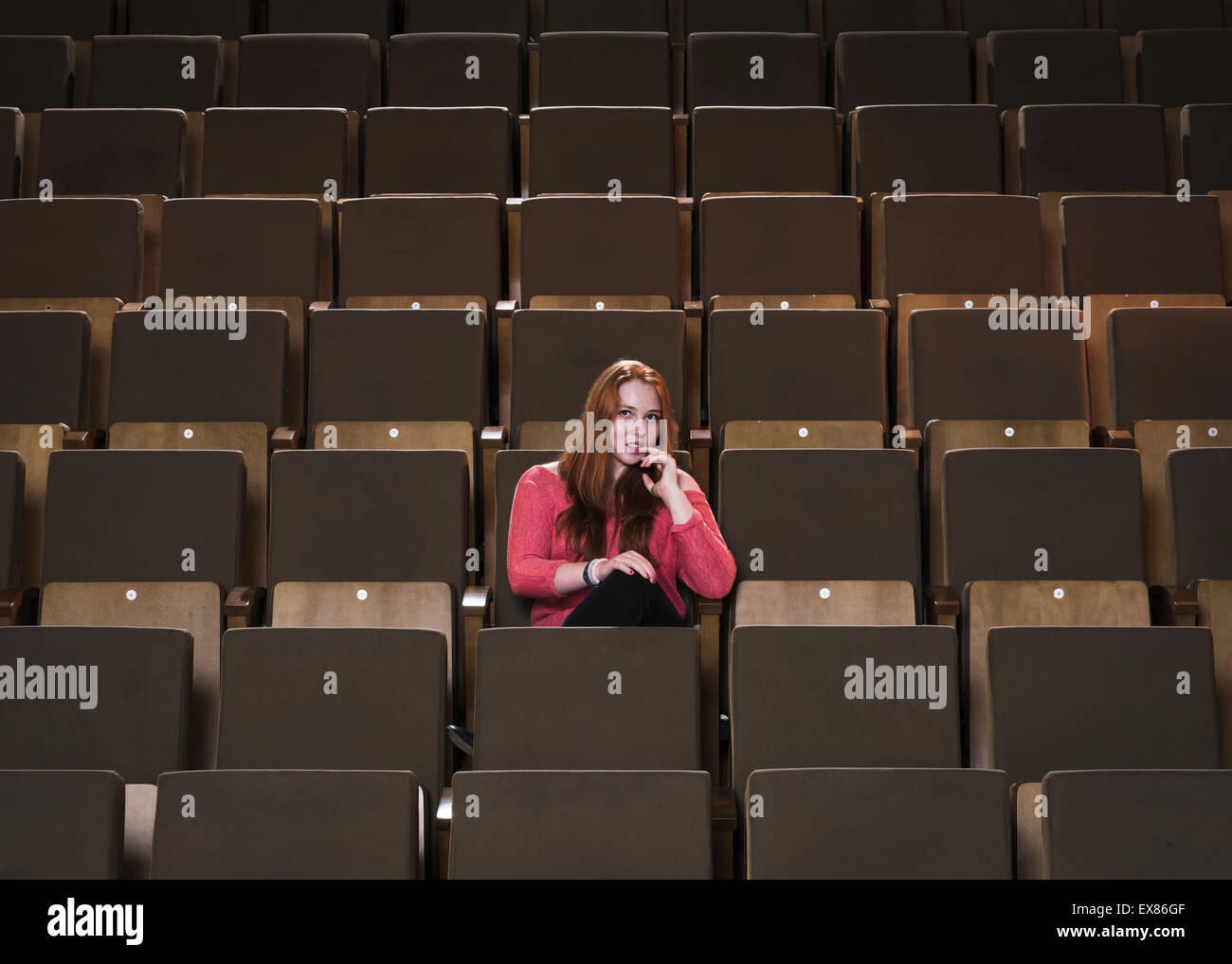 Teenager in a cinema. Stock Photo