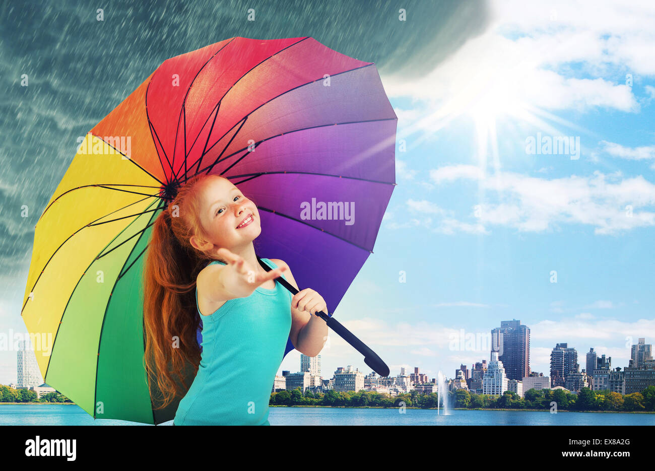 Redhead little girl walking in the rain Stock Photo Alamy