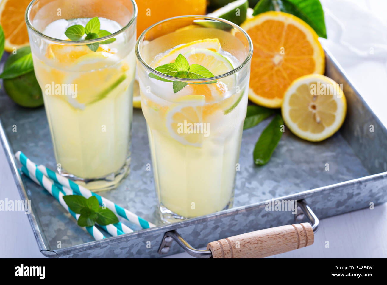 Homemade citrus lemonade in tall glasses with fresh fruits Stock Photo ...