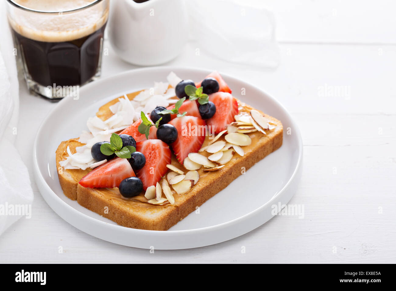 Toast with almond butter and toppings for breakfast Stock Photo Alamy