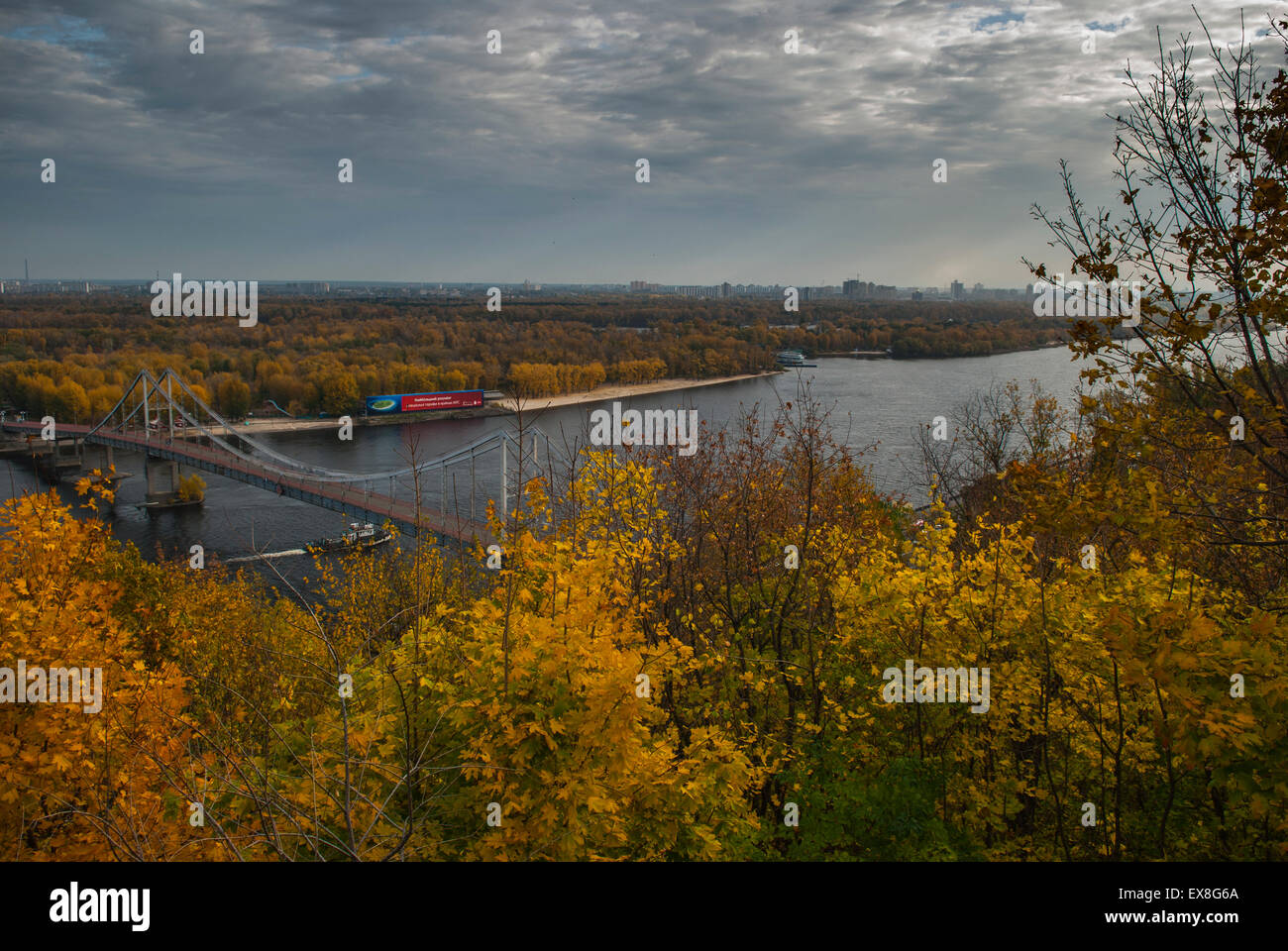 Parkovy Pedestrian Bridge crossing the river Dniper during Autumn in Kiev Stock Photo