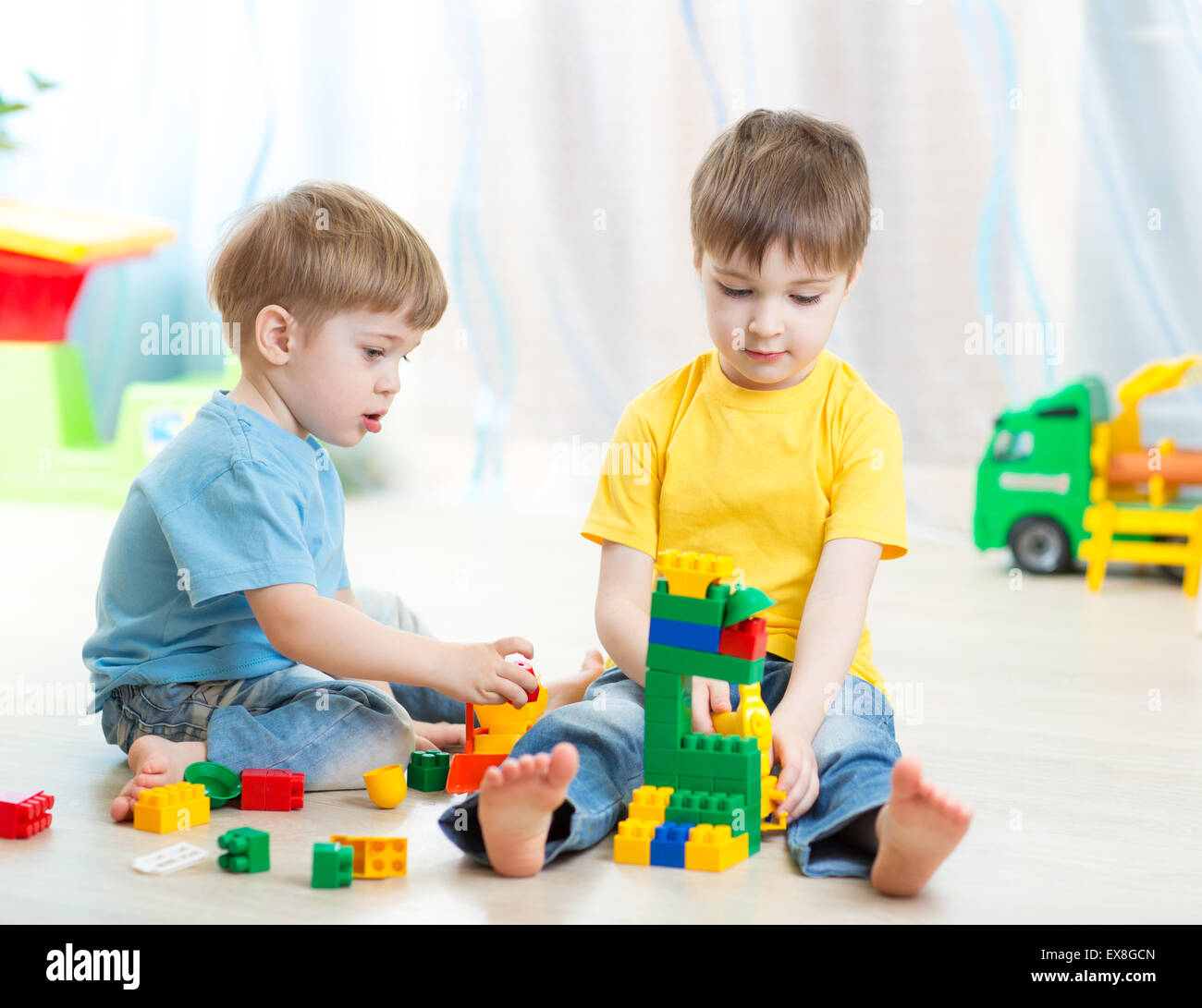 kids playing in playschool or at home Stock Photo
