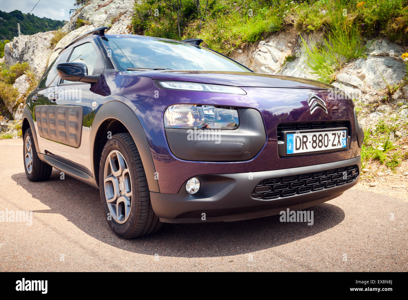 Propriano, France - July 1, 2015: Dark purple Citroen C4 Cactus on the mountain road of Corsica, France Stock Photo