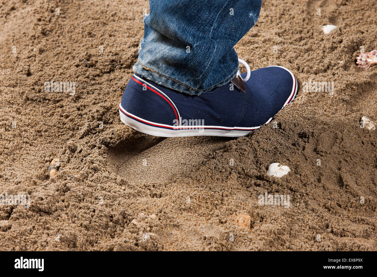 man men shoes sand jeans denim foot print close up studio object lace stone  shell sea beach summer rest vacation south Stock Photo - Alamy