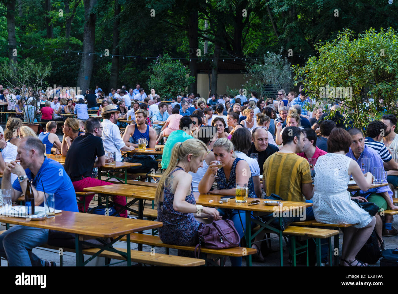 Busy beer garden in summer at Cafe am Neuen See in Tiergarten park in Berlin Germany Stock Photo