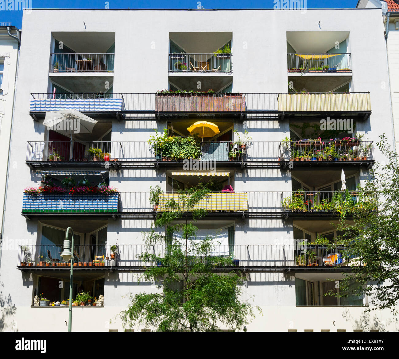 Balconies in summer in modern apartment building in Prenzlauer Berg district of Berlin Germany Stock Photo