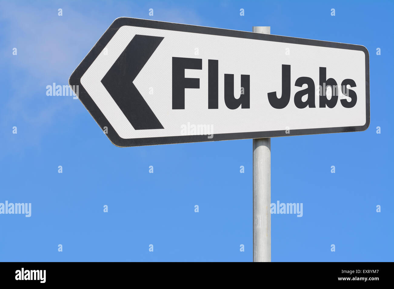 Flu Jabs sign pointing to where to get vaccinated against catching influenza. Stock Photo