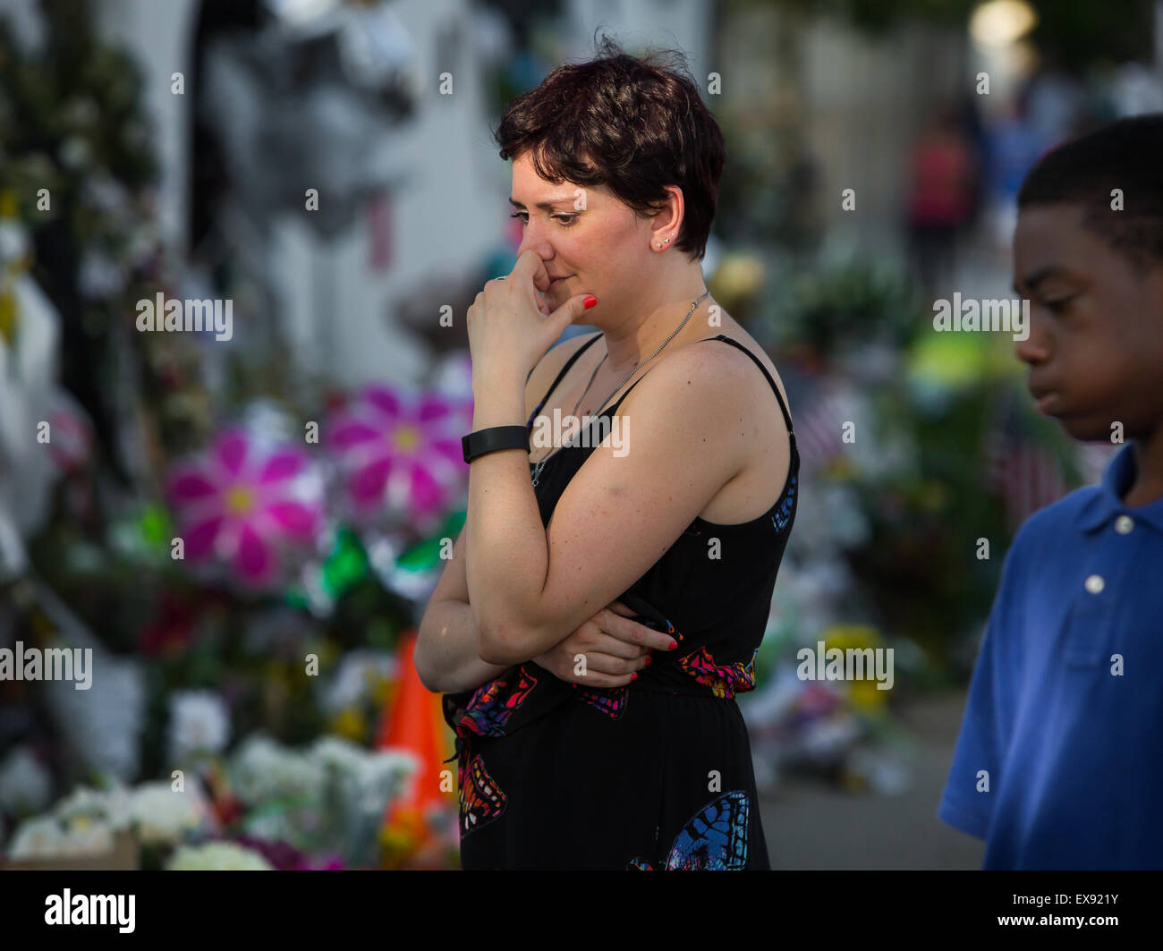 Veronica Nickolaisen, from Rock Hill, grieves in front of Emanuel AME Church. Stock Photo