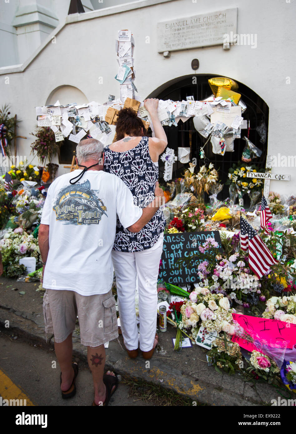 A couple grieves in front of Emanuel AME Church on Calhoun St. in Charleston a week after the shooting that took nine lives. Stock Photo