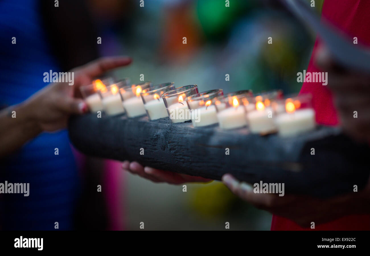 A row of nine candles are lit in remembrance of the nine victims at Emanuel AME Church in Charleston, South Carolina. Stock Photo