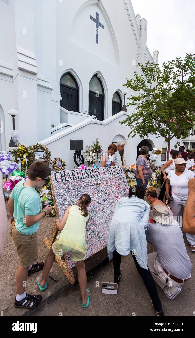 Mourners sign a board in front of Emanuel AME Church in Charleston, South Carolina. Stock Photo