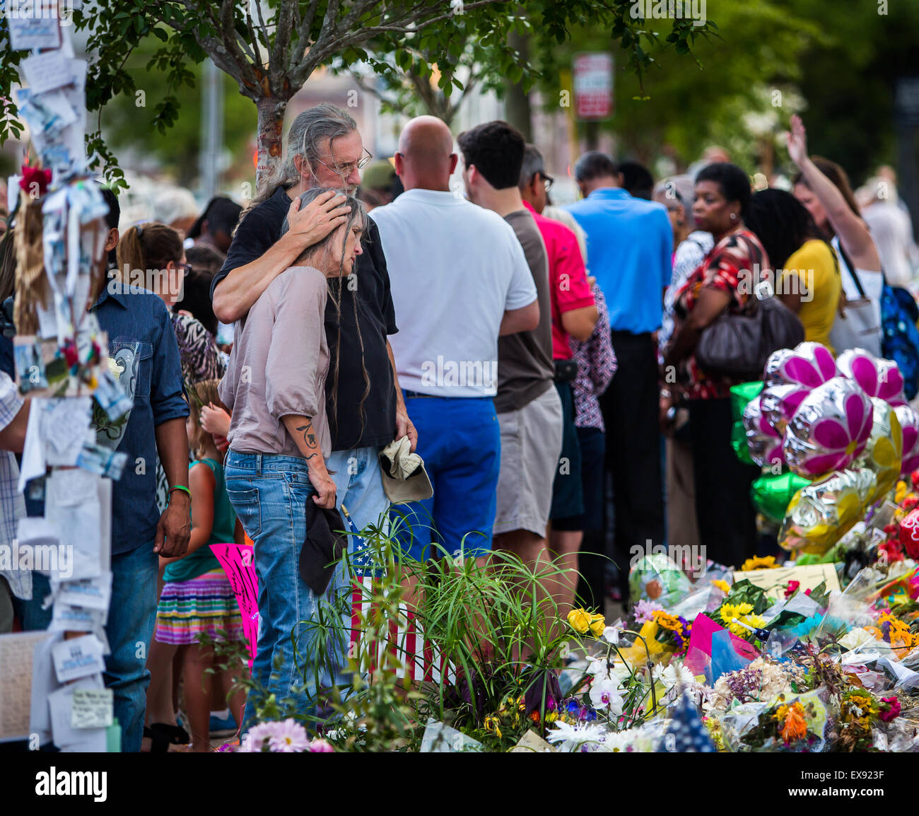 Mourners pay their respect at the memorial that sprung up in front of Emanuel AME Church on Calhoun St. Stock Photo
