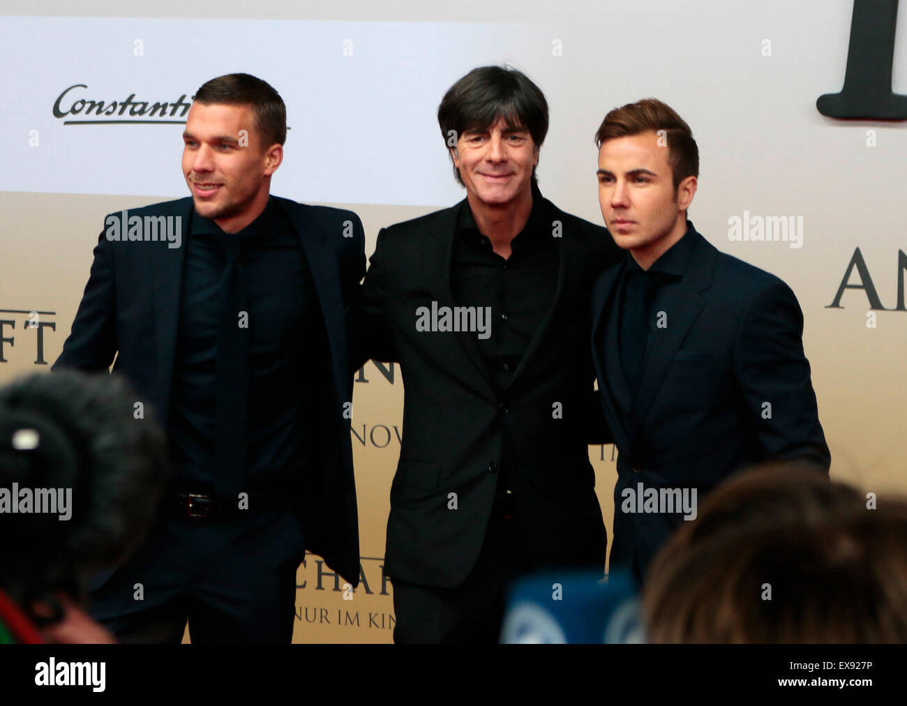 Lukas Podolski, Joachim Loew, Mario Goetze - Premiere des Films ueber den gewinn der Fussball Weltmeisterschaft 2014 'Die Mannsc Stock Photo