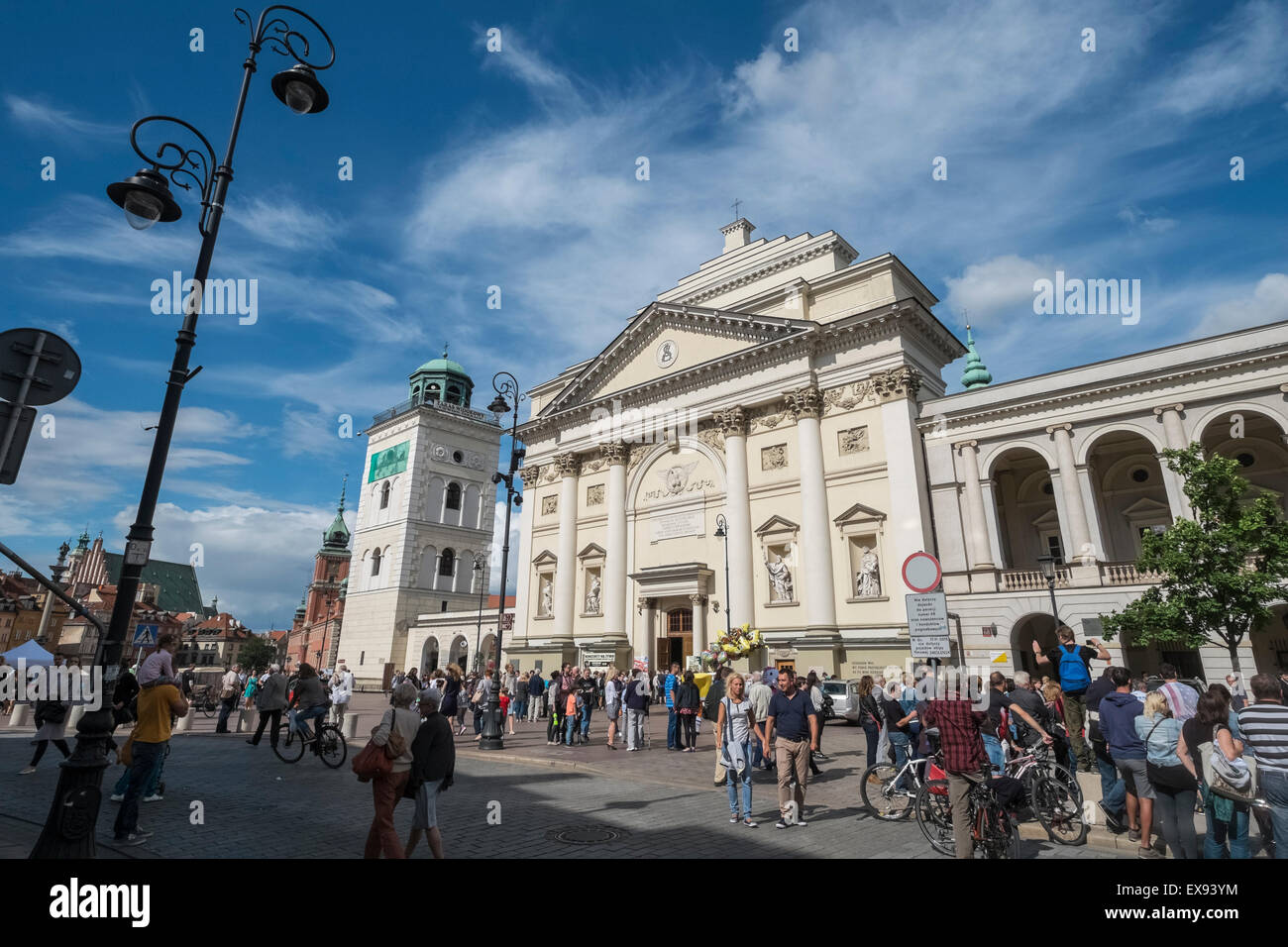 Tourists walking on Krakowskie Przedmiescie street, near St Annes Church, Warsaw, Poland Stock Photo