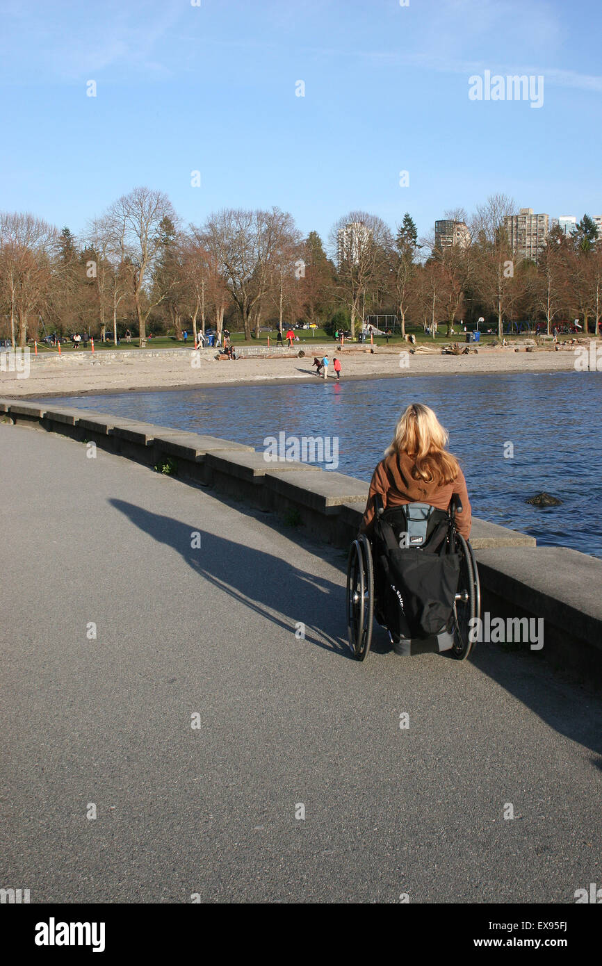 Woman using wheelchair on beach hi-res stock photography and images - Alamy