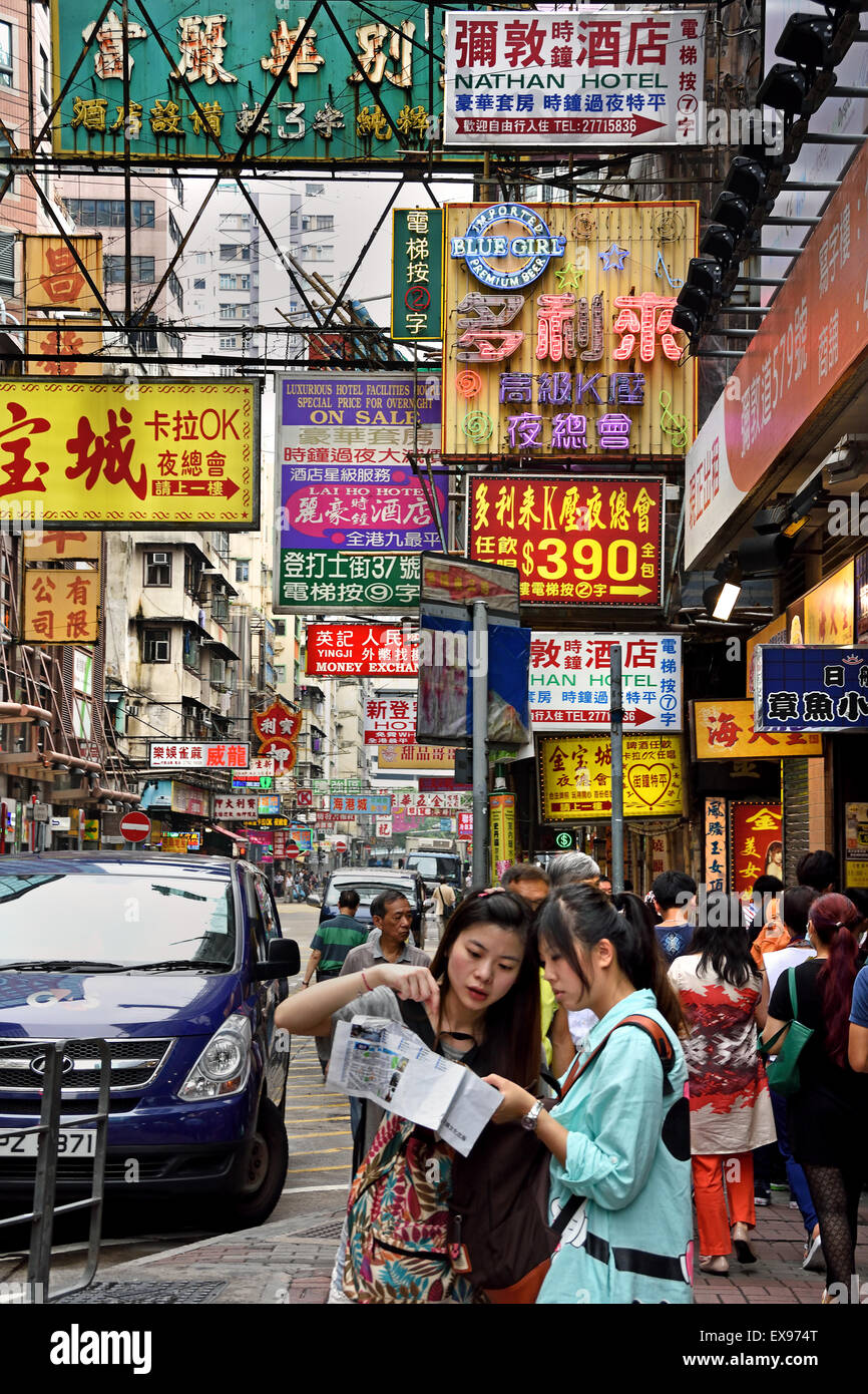 Busy street with advertising signs Mong Kok ( Nathan and Waterloo road Argyle Street district )  Kowloon Hong Kong China Stock Photo