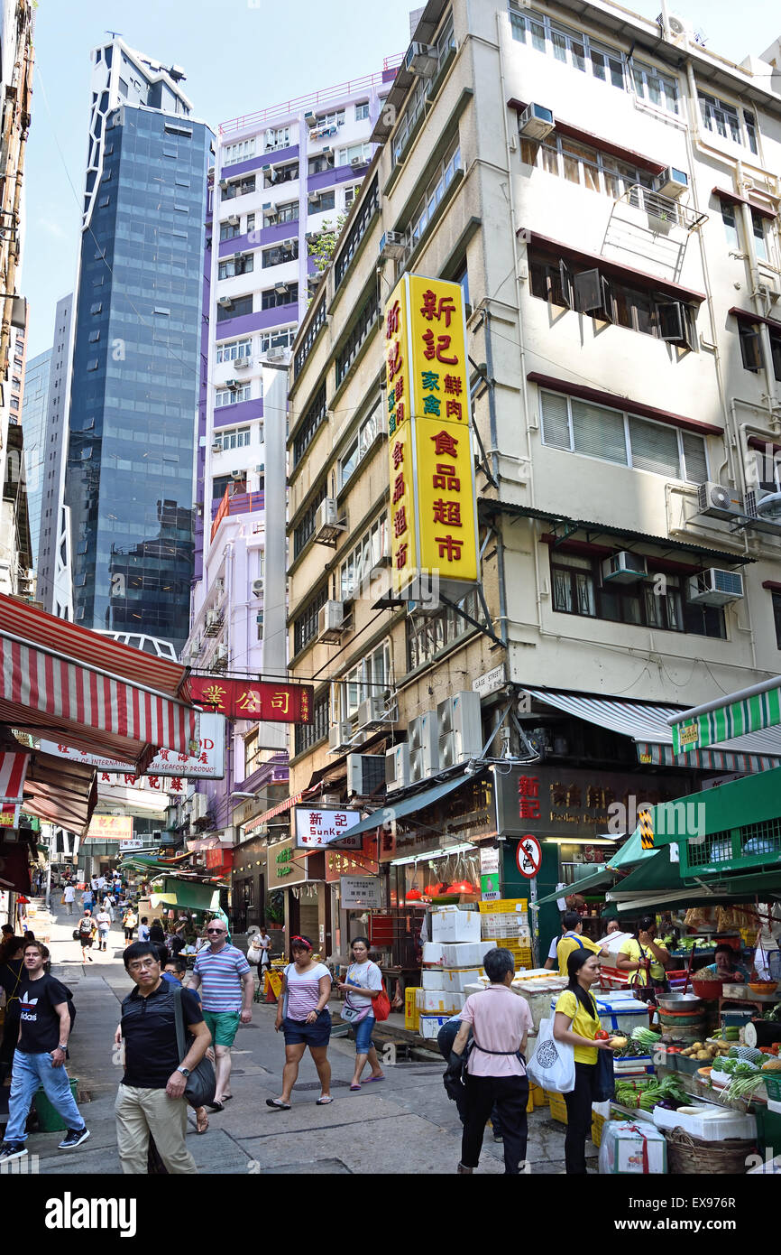 Busy street with advertising signs Mong Kok ( Nathan and Waterloo road Argyle Street district )  Kowloon Hong Kong China Stock Photo