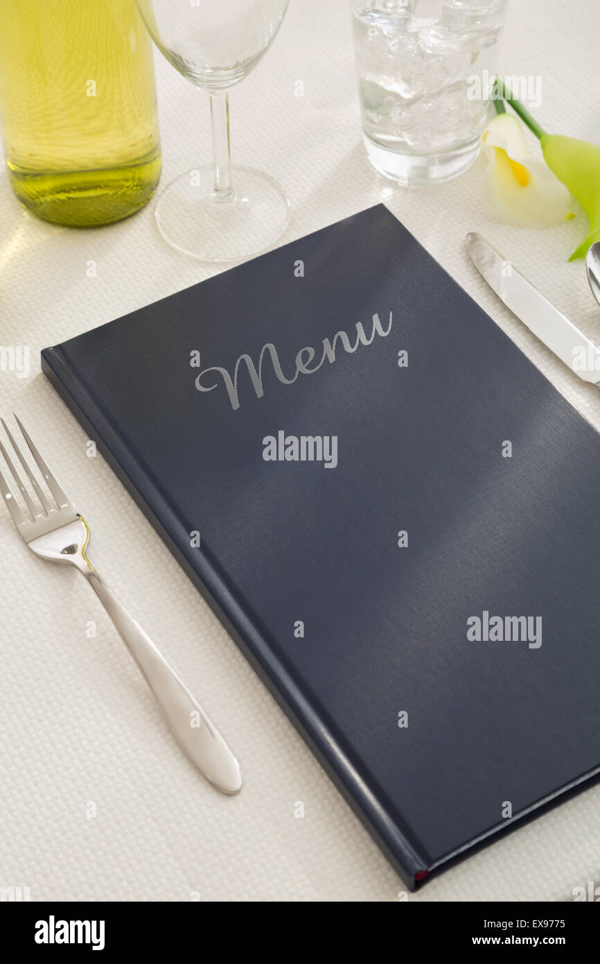 Place setting with cutlery and menu Stock Photo