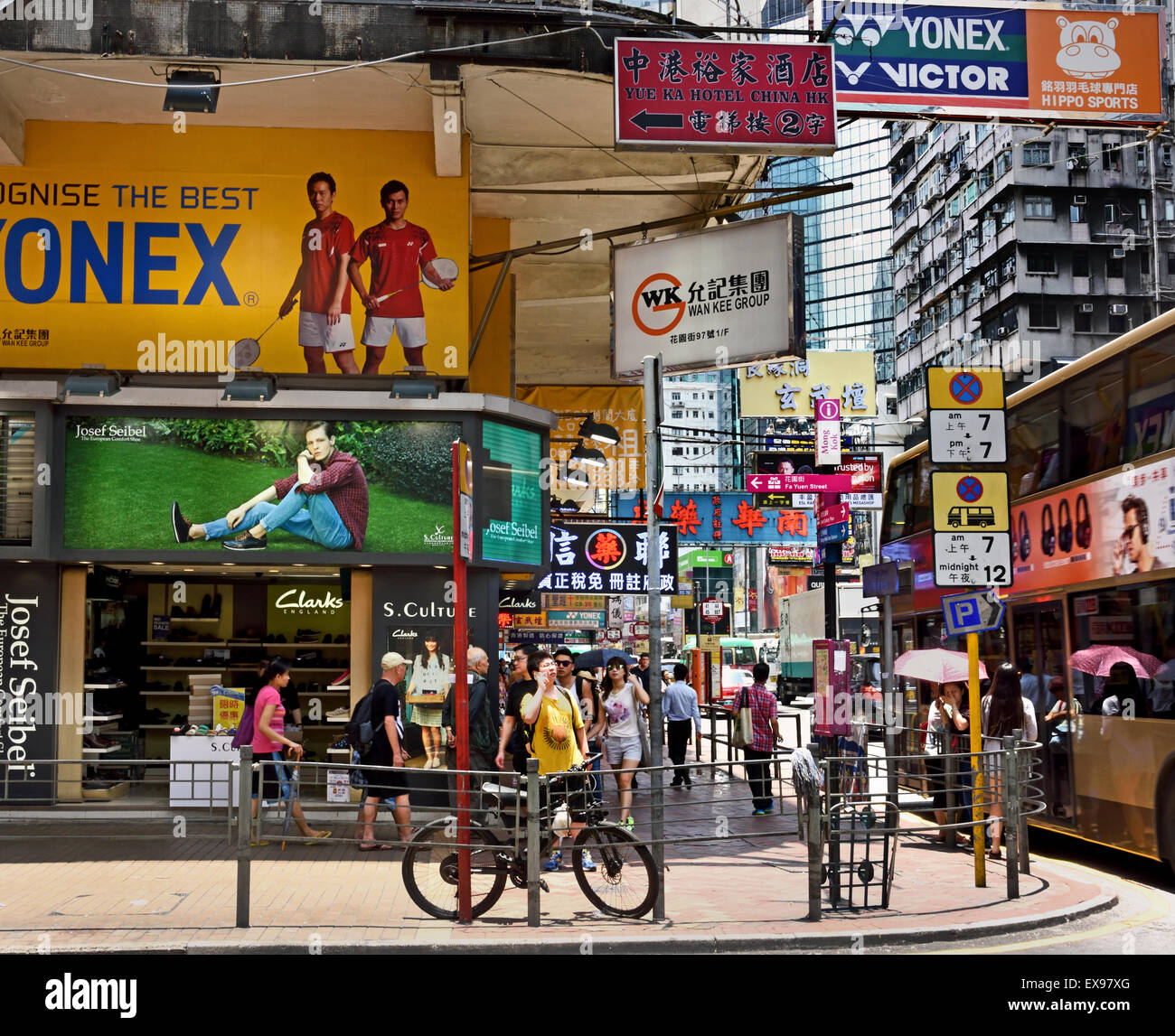 Busy street with advertising signs Mong Kok ( Nathan and Waterloo road Argyle Street district )  Kowloon Hong Kong China Stock Photo