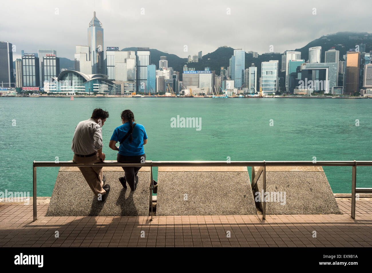 Couple watching Hong Kong skyline Stock Photo