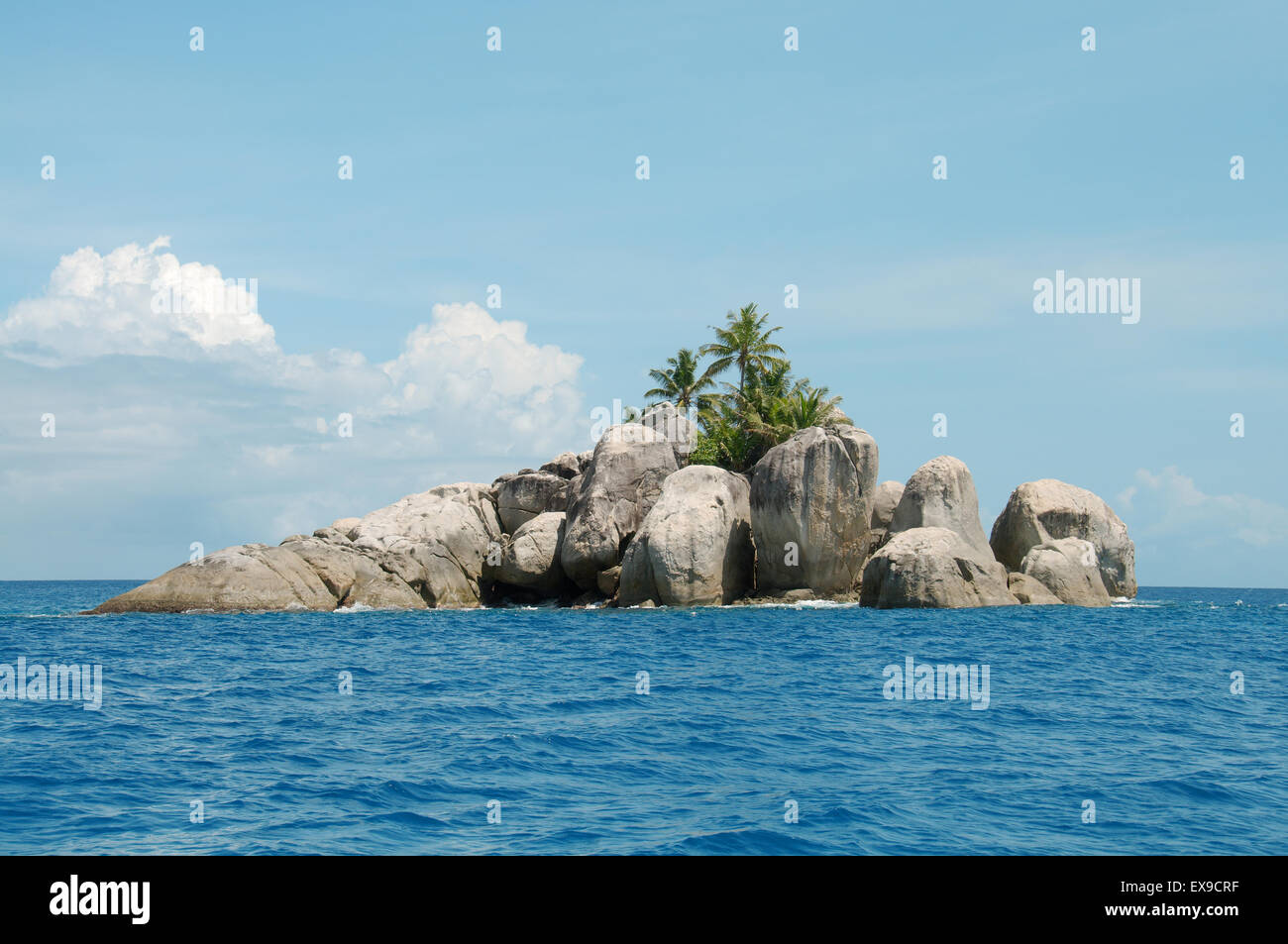 A small rocky island with palm trees near the Mahe island, Indian Ocean