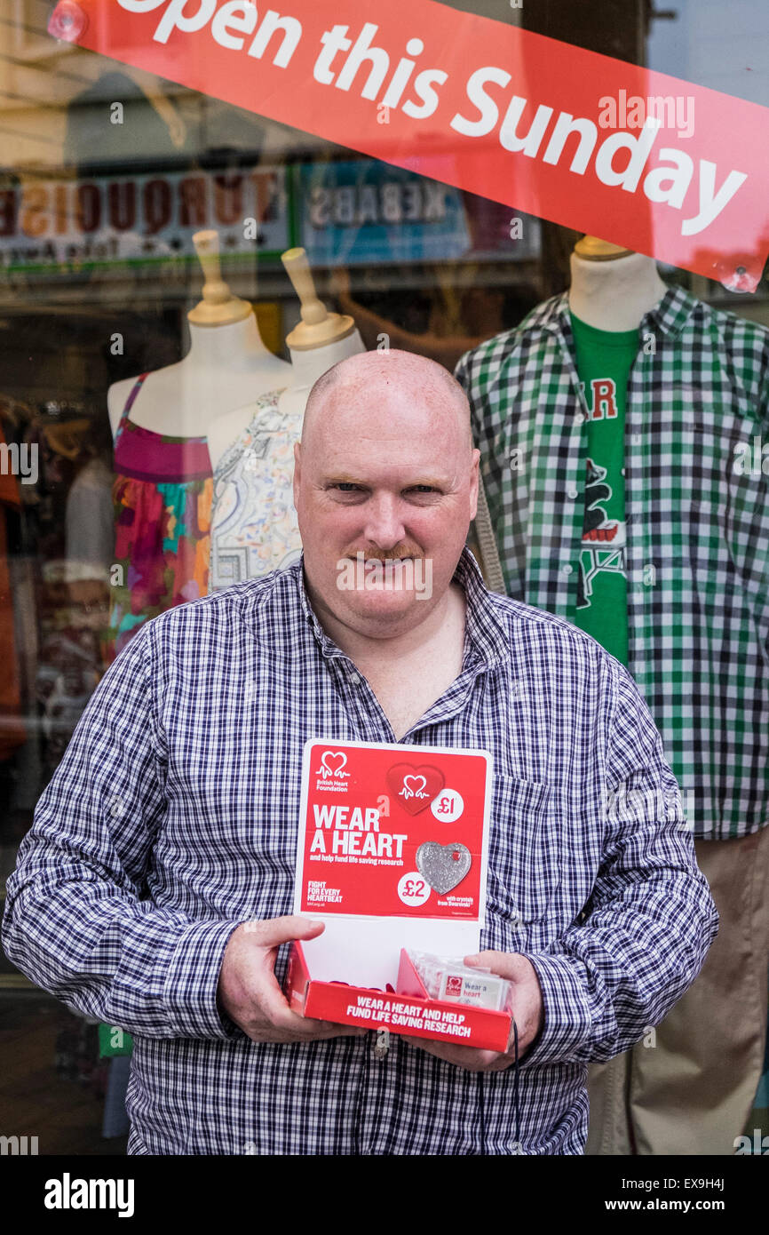 A charity collector for the British Heart Foundation Stock Photo Alamy