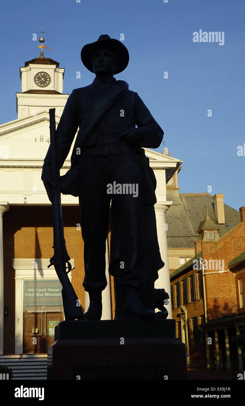 Confederate soldier monument silhouetted against the Old Court House